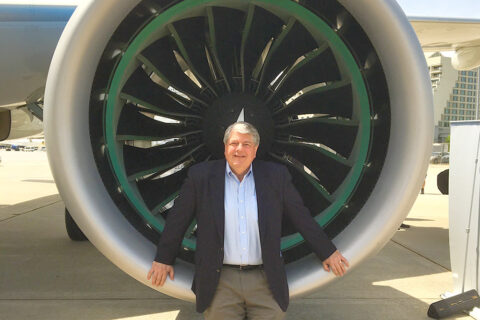 Scott McCartney in front of jet engine
